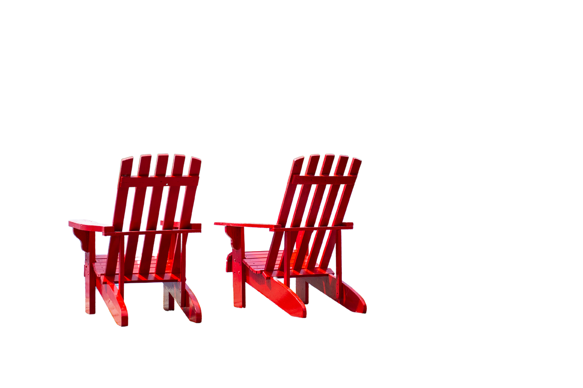 Red Muskoka chairs on a wooden dock